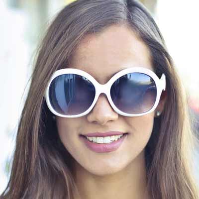 Smiling woman wearing sunglasses